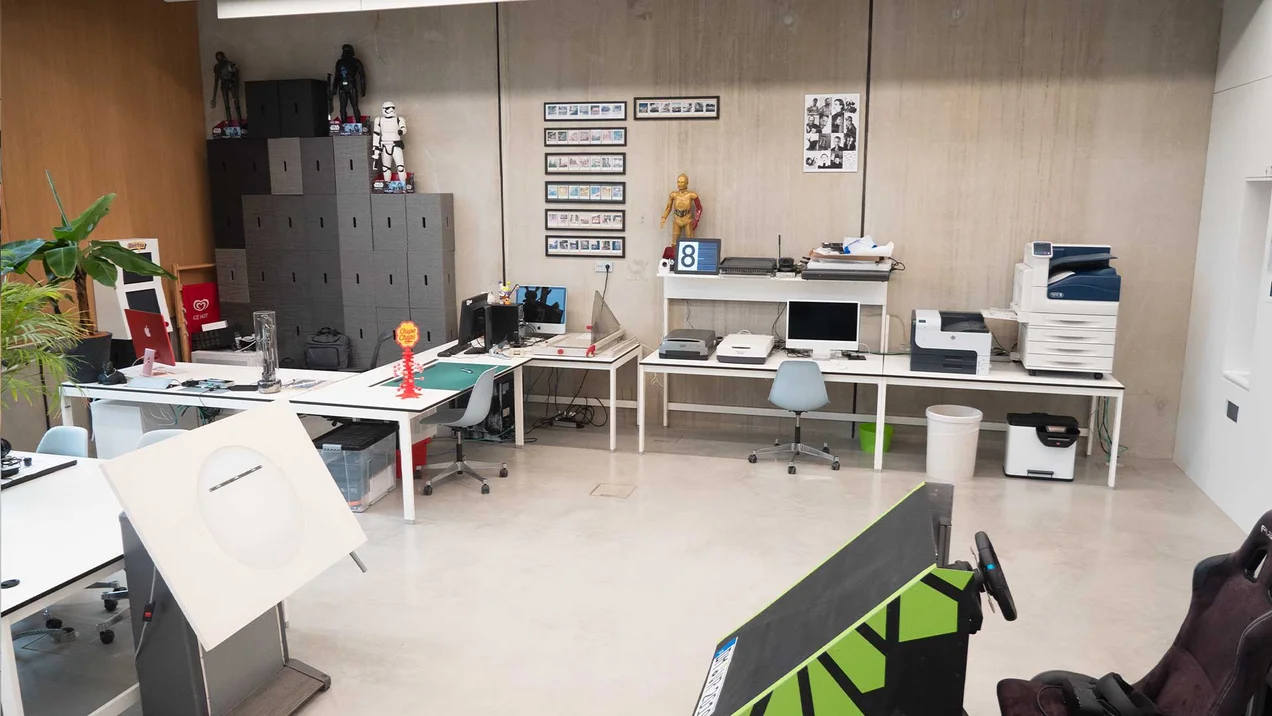 Photo of the Creative Lab with printers, animation table and VR racing seat.