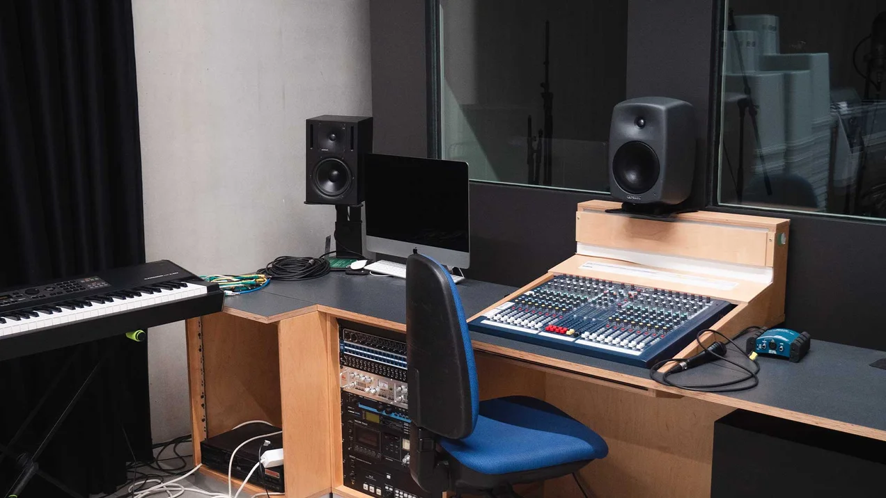 Recording studio with mixing console.